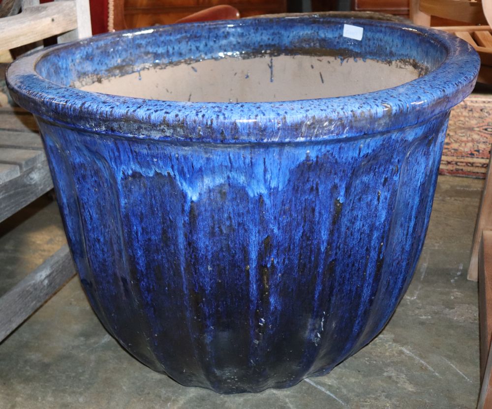 A large blue glazed garden planter, 80cm diameter